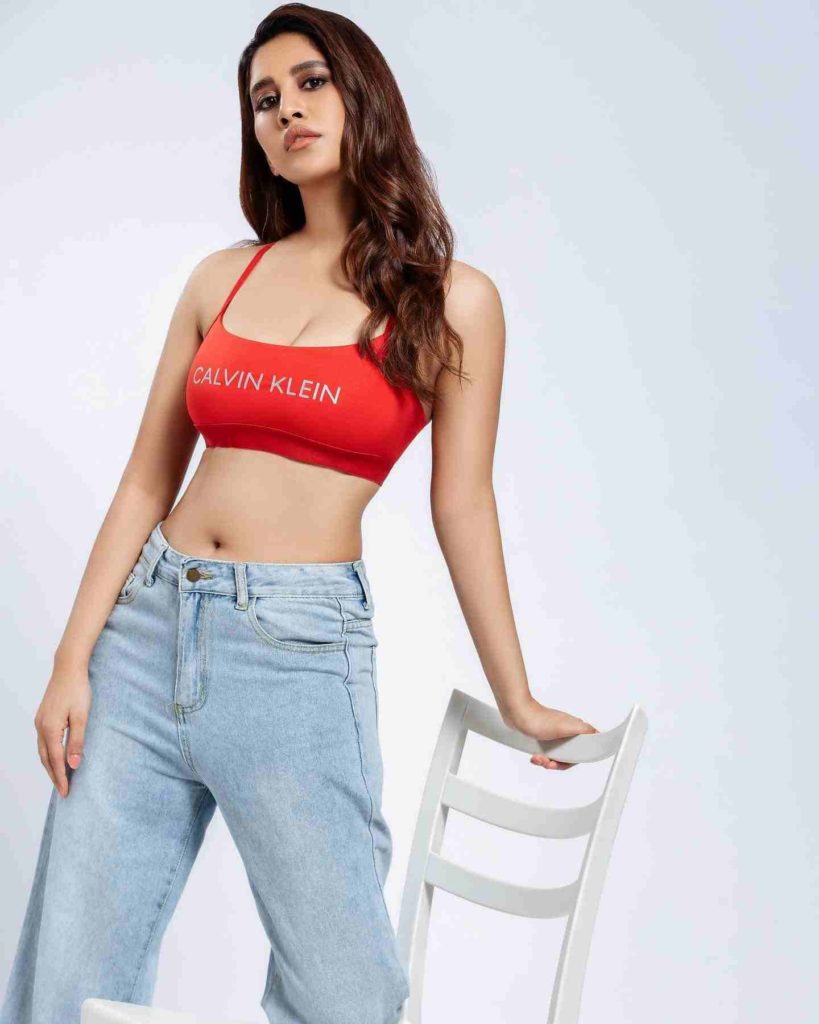 Nabha Natesh in red Calvin Klein top and jeans

